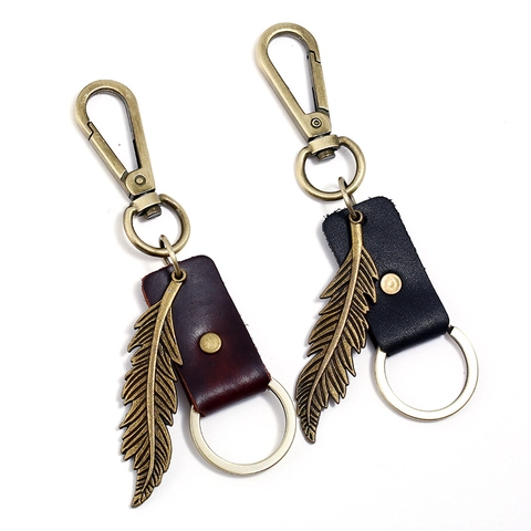 Porte-clés en Cuir Vintage avec Plume en Alliage de Bronze Antique Style Punk Pendentif de Sac Cadeau pour Homme Femme