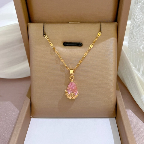 Collana Con Catena In Acciaio Al Titanio E Pendente A Goccia In Cristallo Rosa In Rame Con Base A Fiore Cava