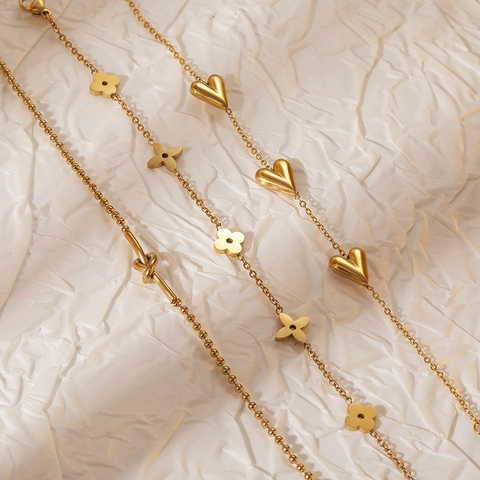 Bracciale in Acciaio Inossidabile Oro con Cuore Quadrifoglio Nodo per Donna Gioiello di Lusso con Catena a Maglie Regolabile