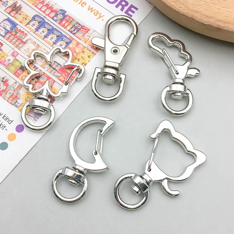 Moschettone Gancio Girevole Lega Zinco Varie Forme DIY Portachiavi Creazione Gioielli Accessorio Cuore Stella Luna Delfino