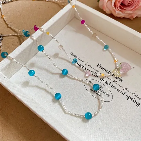 Collana Di Perle Di Cristallo Dolce Con Pendente A Fragola Perle Occhio Di Gatto Blu Catena In Lega Argentata Per Donne