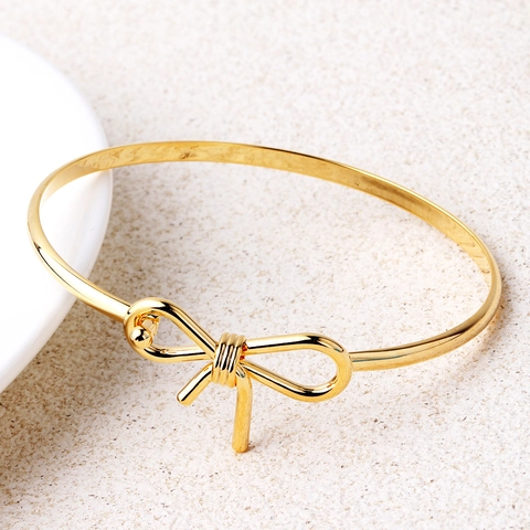 Moda Donna Placcato Oro 18K Rame Bracciale Elegante Minimalista Fiocco Nodo Infinito Design Intrecciato Gioielli Accessorio