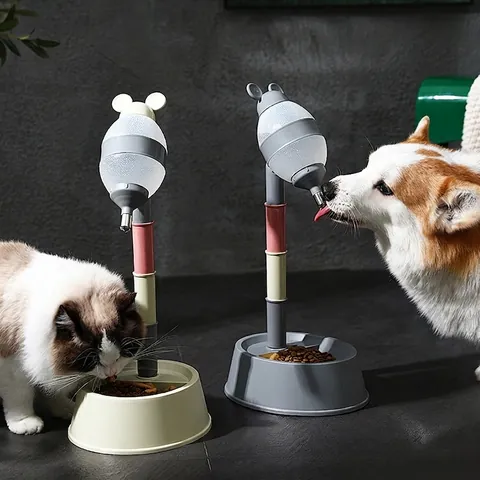 Adjustable Height Standing Pet Water Dispenser And Food Bowl Resin Drip Proof Rolling Ball Automatic Feeder For Dogs Cats