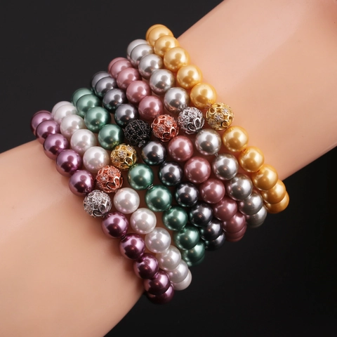 Bracciale Di Künstliche Perle Imitazione Alla Moda Con Sfera Di Strass Svuotata In Lega Elastica Elegante Per Donne