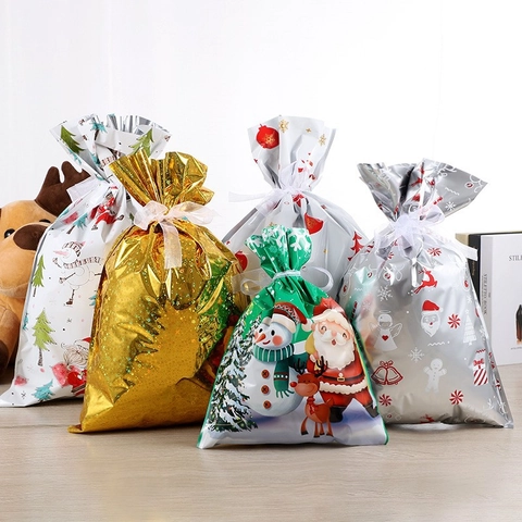 Sacchetti Regalo Di Natale Con Coulisse Plastica Nastro Fiocco Confezione Caramelle Bomboniere Babbo Natale Pupazzo Di Neve Cervo Stampato