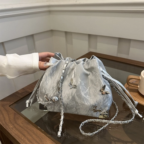 Women Pleated PU Leather Bucket Bag Metallic Butterfly Decor Drawstring Crossbody Bag With Chain Strap Fashion Chic