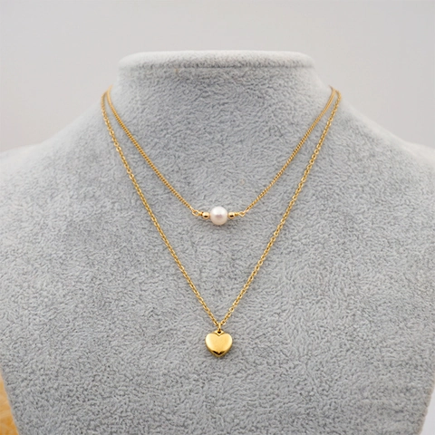 Collana A Doppio Strato Con Perla de Agua Dulce D'acqua Dolce E Ciondolo A Cuore In Acciaio Al Titanio Colore Oro Gioielli Minimalisti