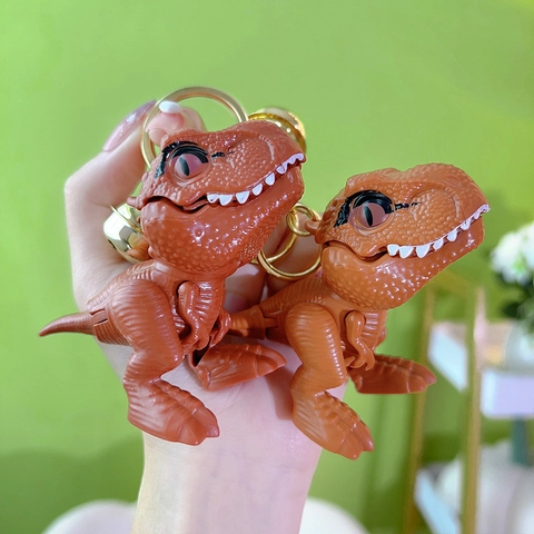 Cartoon Dinosaurus T-Rex Sleutelhanger Kunststof Bijtende Hand Actie Speelgoed Rugzak Hanger Met Metalen Ring En Bel
