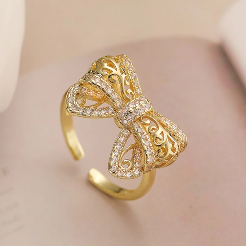 Bague Ouverte Noeud En Cuivre Plaqué Or 18K Design Creux Zircone Incrusté Bijoux De Doigt Réglables Pour Femmes