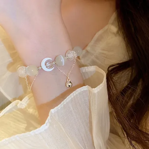 Bracciale Di Perline Con Pietra Occhio Di Gatto Perle In Vetro Crackle Pendente Luna Bianca E Campanellino Argento Per Donna