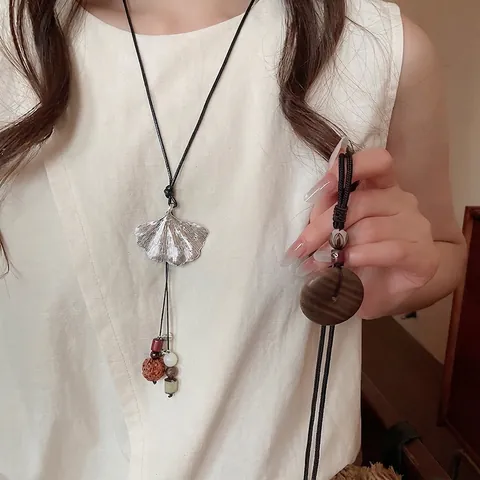 Collana Con Pendente Etnico Retro Legno Lega Foglia Di Ginkgo Ping An Kou Nuvola Di Buon Auspicio Cavo Lunga Corda Intrecciata