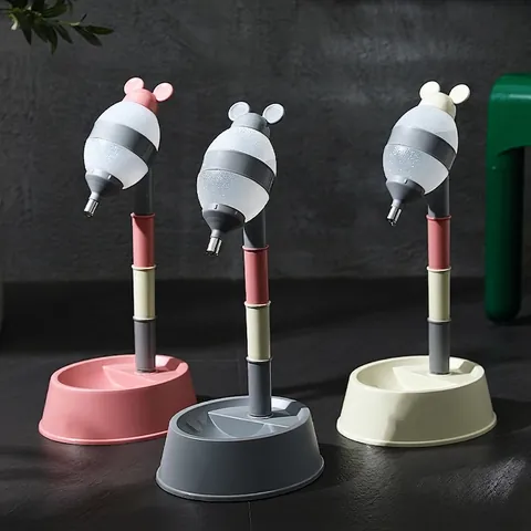 Adjustable Height Standing Pet Water Dispenser And Food Bowl Resin Drip Proof Rolling Ball Automatic Feeder For Dogs Cats