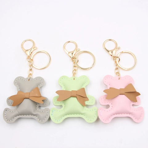 Simpatico Orso Portachiavi Pelle PU Fiocco Ciondolo Metallo Dorato Per Borsa Accessorio Donne Ragazze Cartone Animato