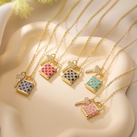 Elegant 18K Gold Plated Copper Necklace with Zirconia Drip Oil Checkerboard Lock and Heart Key Pendant Jewelry for Women