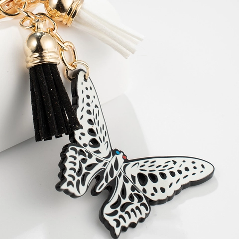 Mode Hohl Schmetterling Anhänger Schlüsselanhänger Mit Schwarz Und Weiß Quasten Gold Metall Schlüsselring Tasche Charme Für Damen Schmuck