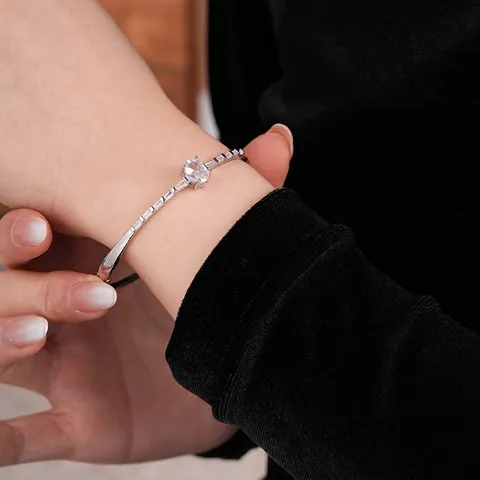 Elegant Copper Bangle Bracelet With Oval Zircon Main Stone And Baguette Side Stones Luxury Fashion Jewelry For Women