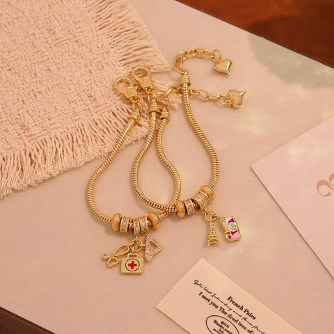 Bracciale Con Ciondoli In Rame Placcato Oro 18K Catena A Serpente Con Ciondoli A Tema Musica Medicina Viaggio Gioielli In Zircone Per Donna