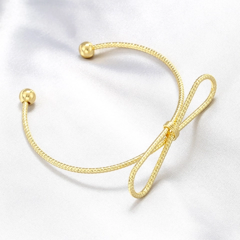 Sweet Minimalist Copper Gold Plated Smooth Surface Snake Texture Bow Bangle Geometric Twist Knot Open Bracelet For Women Fashion Jewelry