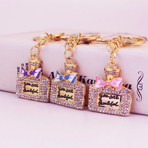Luxury Zinc Alloy Perfume Bottle Keychain With Ribbon Rhinestone Enamel Bow Elegant Bag Pendant For Women Gift