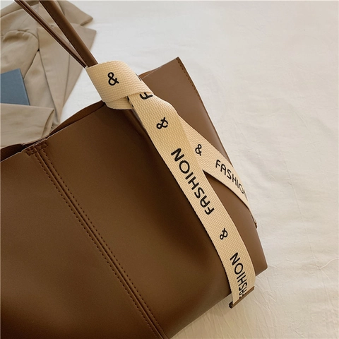 Große Kapazität PU Leder Tote Bag Mode Band Dekoration Pendler Schultertasche Nischenstil High End Für Frauen