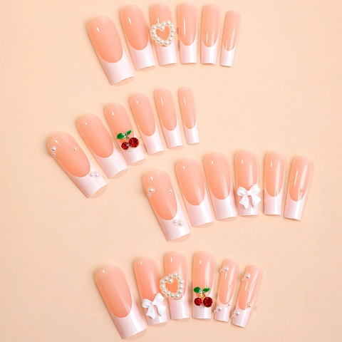 Faux Ongles French Tip Cercueil Long Avec Breloques Cerise Coeur En Künstliche Perle Et Noeuds Blancs Rose Nude Ongles Postiches