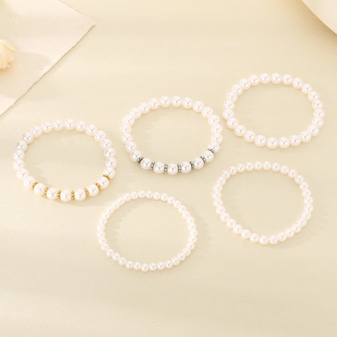 Elegante Bracciale Elastico Con Künstliche Perle Di Vetro Bianche E Distanziatori In Acciaio Inossidabile Gioielli Da Donna