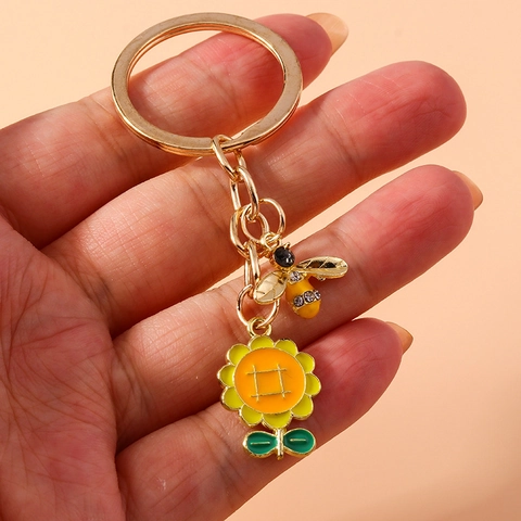 Portachiavi in Lega di Smalto Ape Girasole Stile Pastorale Carino Animale del Fumetto Fiore Ciondolo Zaino Auto Regalo Donna