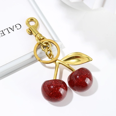 Portachiavi Ciliegia Rossa Glitter per Borsa Donna Ciondolo Frutta in Resina Foglia Oro di Alta Gamma Elegante Accessorio