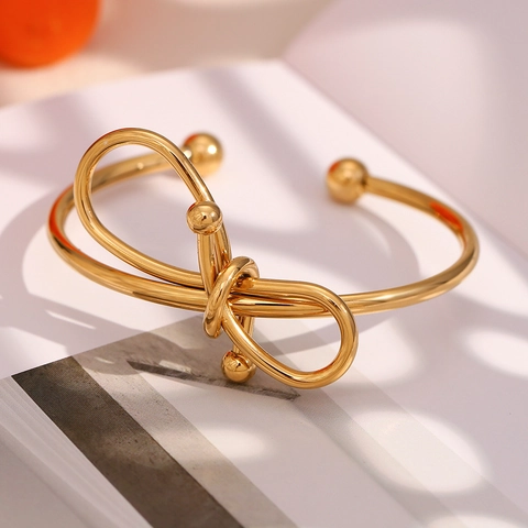 Bracciale Rigido Aperto con Fiocco in Acciaio Inossidabile da Donna Placcato Oro 18K Nodo Geometrico Regolabile Gioielli