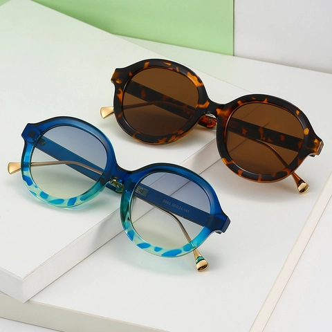 Lunettes De Soleil Rondes Rétro Femmes Monture PC Branches Métal Protection UV400 Style Vintage Léopard Écaille