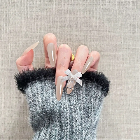 Uñas Postizas Ojo De Gato Larga Forma Almendra Lazo 3D Diamantes De Imitación Nude Champaña Brillante Estilo Lujo Para Mujeres