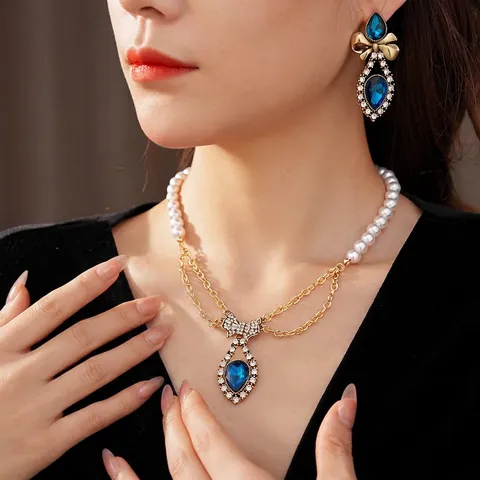 Collana Di Künstliche Perle E Orecchini Vintage Con Fiocco Strass Goccia D'acqua Blu Per Donne Eleganti