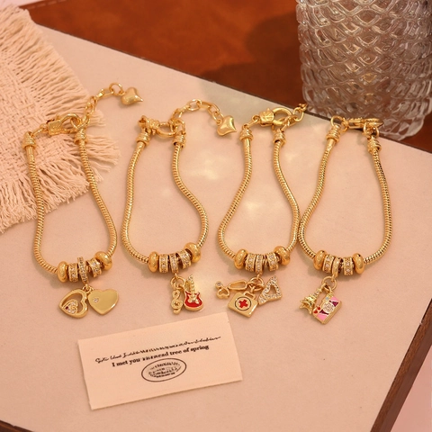 Bracciale Con Ciondoli In Rame Placcato Oro 18K Catena A Serpente Con Ciondoli A Tema Musica Medicina Viaggio Gioielli In Zircone Per Donna