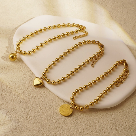 Bracciale Retrò in Acciaio al Titanio con Perline Oro Argento Cuore Moneta Ritratto di Elisabetta II Regolabile per Donna