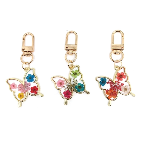 Llavero De Mariposa Con Flores Secas Reales Resina Transparente Marco De Aleación De Oro Colante Estilo Pastoral