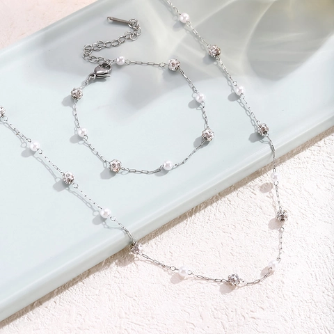 Elegante Collana e Bracciale in Acciaio al Titanio Con Perle Artificiali e Sfere di Strass Gioielli Galvanizzati da Donna