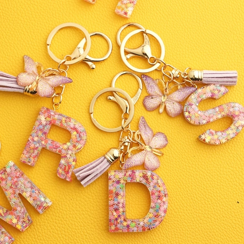 Porte-clés Alphabet en Résine Flocon de Neige Rose avec Papillon et Gland Paillettes pour Sacs de Femmes