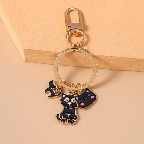 Mignon Porte-clés Chat Noir en Émail Alliage de Zinc Or Métal Pendentif de Sac Ornement de Téléphone pour Femmes