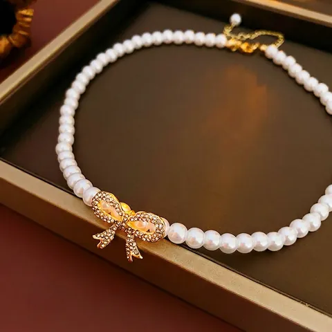 Künstliche Perlenkette Mit Strass Besetztem Legierungsschleifen Anhänger Elegante Modeschmuck Schlüsselbeinkette Für Damen