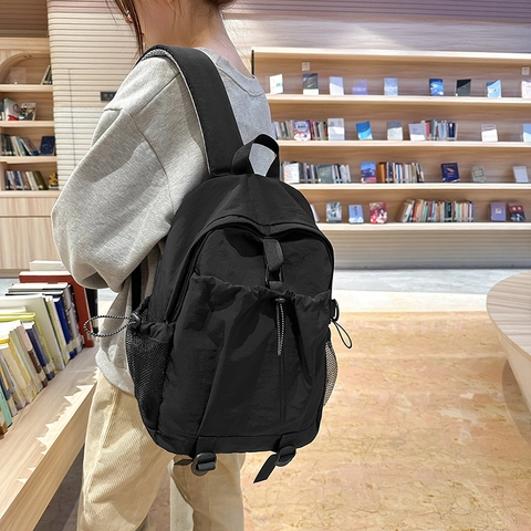 Sac à Dos en Nylon pour Femmes Grande Capacité Sac d'École Décontracté Avec Poche Avant à Cordon et Poches Latérales en Filet