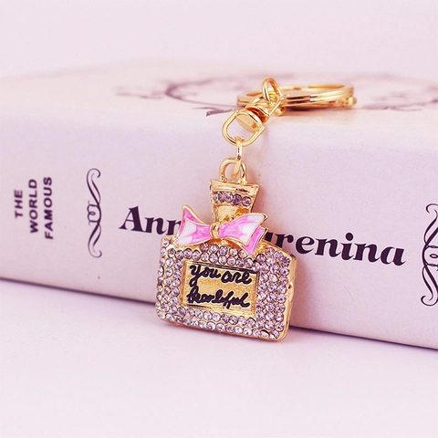 Luxury Zinc Alloy Perfume Bottle Keychain With Ribbon Rhinestone Enamel Bow Elegant Bag Pendant For Women Gift