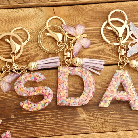 Porte-clés Alphabet en Résine Flocon de Neige Rose avec Papillon et Gland Paillettes pour Sacs de Femmes