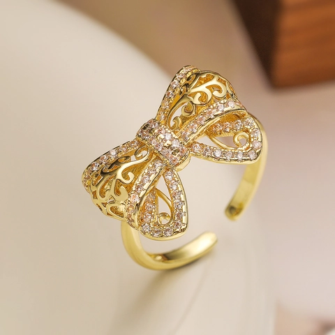 Bague Ouverte Noeud En Cuivre Plaqué Or 18K Design Creux Zircone Incrusté Bijoux De Doigt Réglables Pour Femmes