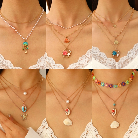 Collana Multistrato con Pendente a Conchiglia e Stella Marina Donna Placcata Oro Argento Perla Artificiale Strass Gioielli Oceano