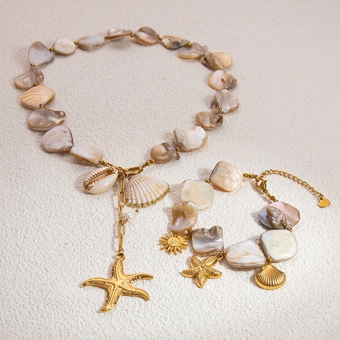 Set di Gioielli a Tema Marino Placcato Oro 18K in Acciaio Inossidabile Collana con Pendente Stella Marina Sole Bracciale Donna