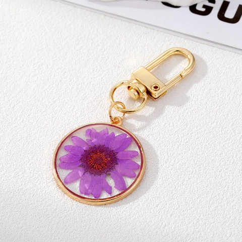 Portachiavi con Ciondolo a Forma di Margherita in Resina Trasparente con Fiori Secchi Pastorale Charm per Borsa in Metallo Dorato