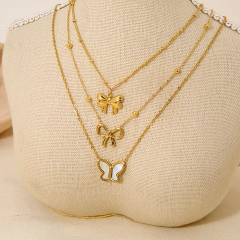 Collana con Pendente a Fiocco e Farfalla in Acciaio Inossidabile Minimalista da Donna Placcato Oro 18K Intarsio in Perla Artificiale Catena a Clavicola Gioielli Impermeabili