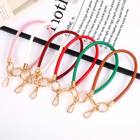 Portachiavi in Corda di Pelle Artificiale alla Moda per Ciondolo Borsa Donna Cinturino da Polso Rifinito a Mano Anti-Smarrimento