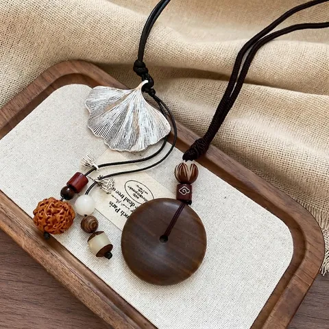 Collana Con Pendente Etnico Retro Legno Lega Foglia Di Ginkgo Ping An Kou Nuvola Di Buon Auspicio Cavo Lunga Corda Intrecciata
