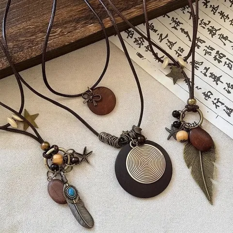 Collier Long Bohème Rétro Corde En Cuir Pendentif Plume Étoile Alliage Style Ethnique Accessoire Fait Main